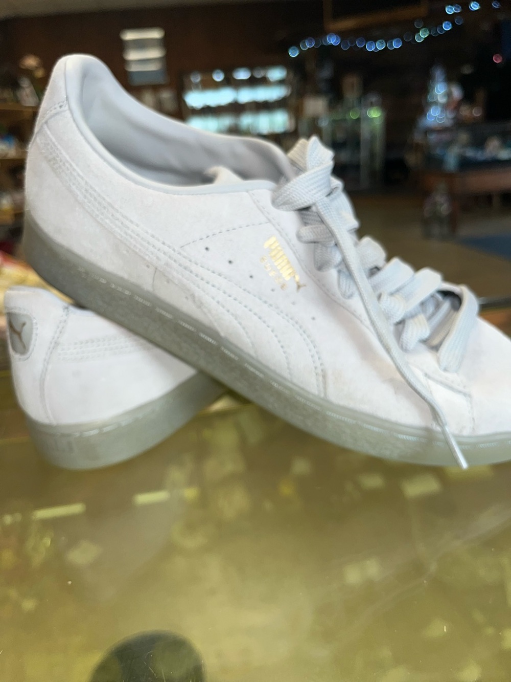 Puma Suede Low-Top Sneakers in Light Gray with Gold Logo